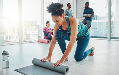 Buy stock photo Yoga, studio and exercise mat with a fitness black woman getting ready for a wellness workout. Gym, training and zen with a female yogi indoor for mental health, balance or spiritual health