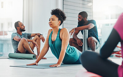 Buy stock photo Yoga class, people and fitness exercise for health, peace and wellness at a gym. Black woman and men group in health studio for holistic workout, cobra and body balance with zen energy or mindfulness