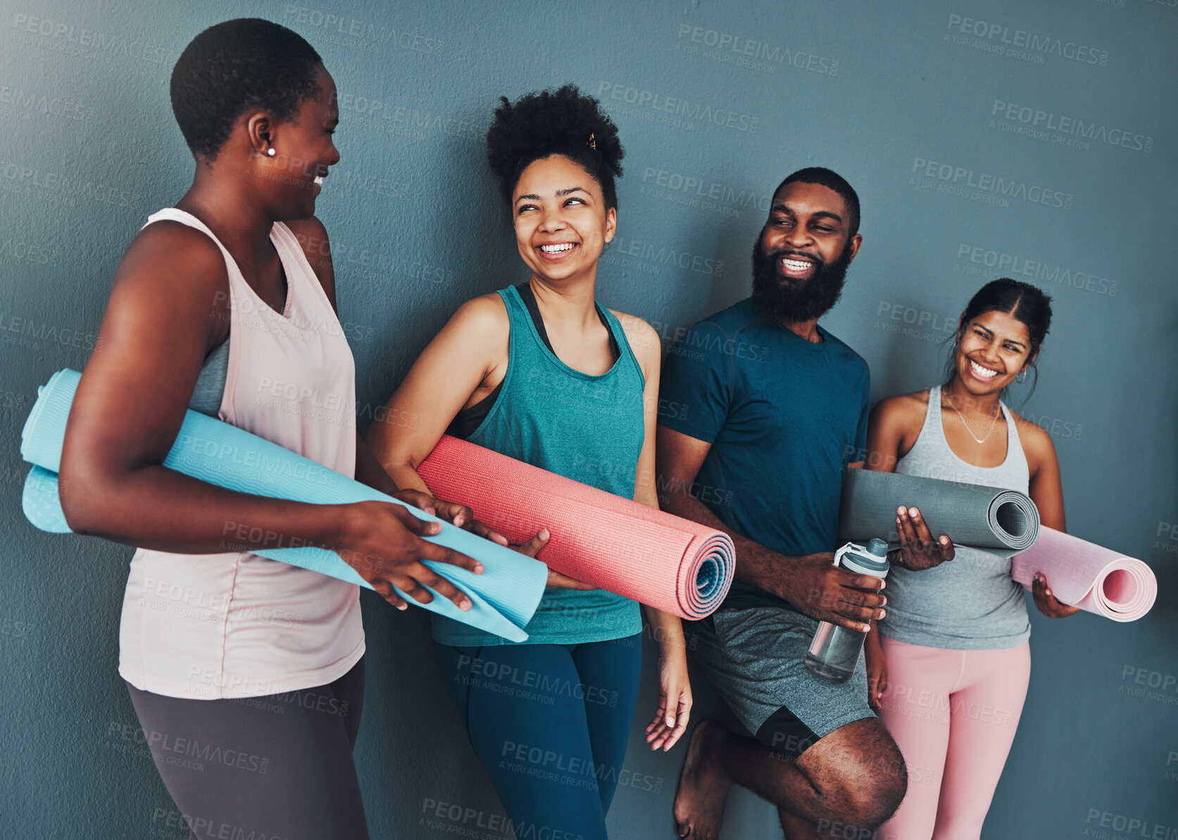 Buy stock photo Yoga, talking friends and wall of pilates class in a gym with a exercise and training break. Conversation, wellness and communication of black people together ready for zen, balance and relax