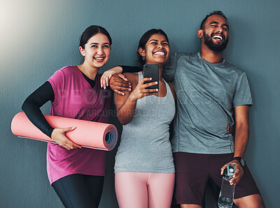 Buy stock photo Fitness friends laugh with phone and diversity, funny meme on social media and exercise together with yoga mat. Comedy online, workout group in gym with healthy lifestyle, wellness and happy people
