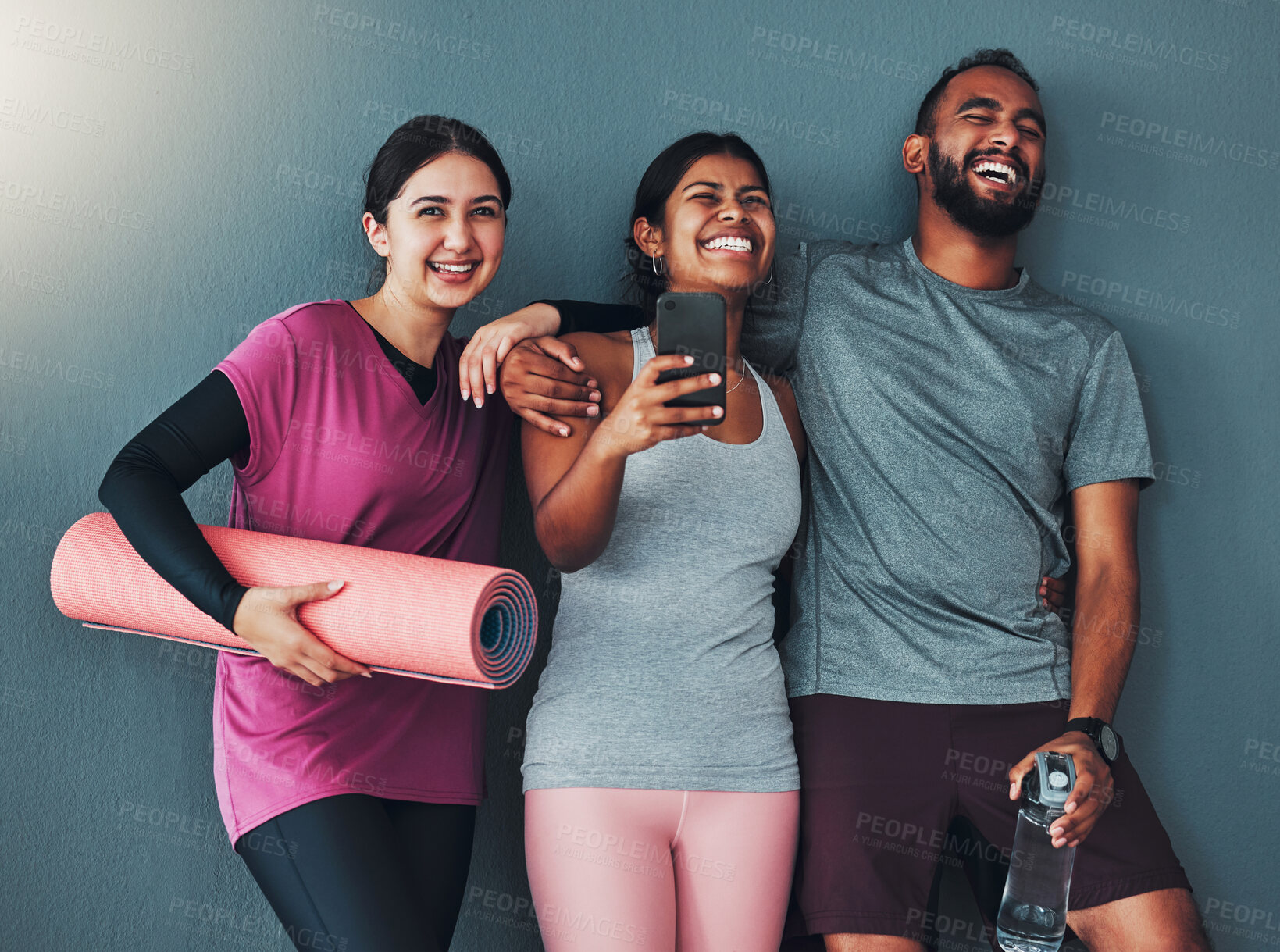 Buy stock photo Fitness friends laugh with phone and diversity, funny meme on social media and exercise together with yoga mat. Comedy online, workout group in gym with healthy lifestyle, wellness and happy people