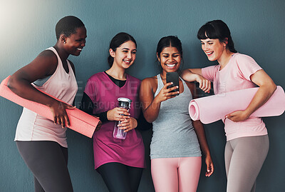 Buy stock photo Fitness, friends and funny meme on smartphone, online comedy while at gym with women at yoga and exercise. Workout together, diversity and social media with connection and health on studio background
