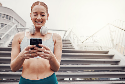 Buy stock photo City, workout and woman with smartphone, smile for communication, typing and headphones after exercise. Health, training and runner on 5g phone, fitness app to connect or network in sports.