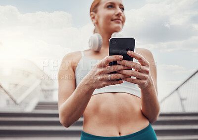 Buy stock photo City, fitness and woman with smartphone, communication and smile typing after exercise low angle. Health, workout and personal trainer on phone, conversation and connect or network in sports training
