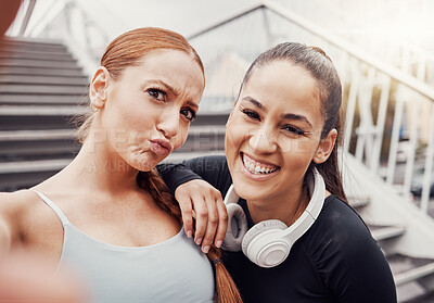Buy stock photo Fitness, portrait or friends in a happy selfie in training, exercise or workout in city with headphones. Runners, sports women or funny girls in partnership in a photo for social media app laughing