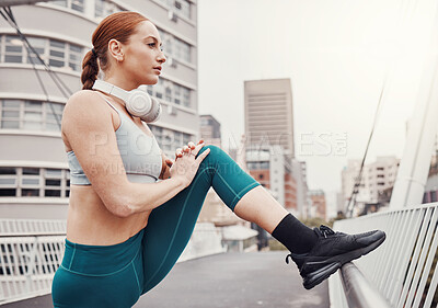Buy stock photo Sports, fitness and woman stretching legs in city for motivation, warm up and ready for cardio workout. Running, exercise and girl in London town for healthy body, wellness and marathon training