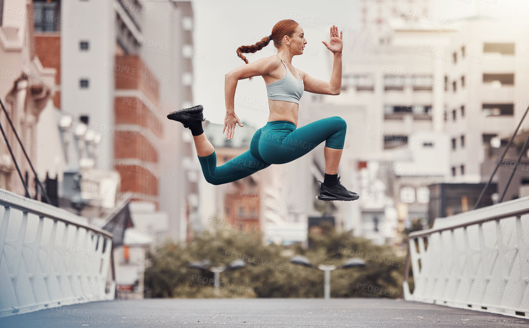 Buy stock photo Workout, jump and health with woman in city for training, cardio and endurance. Energy, fitness and exercise with girl athlete and warm up in urban town for sports, running and body wellness