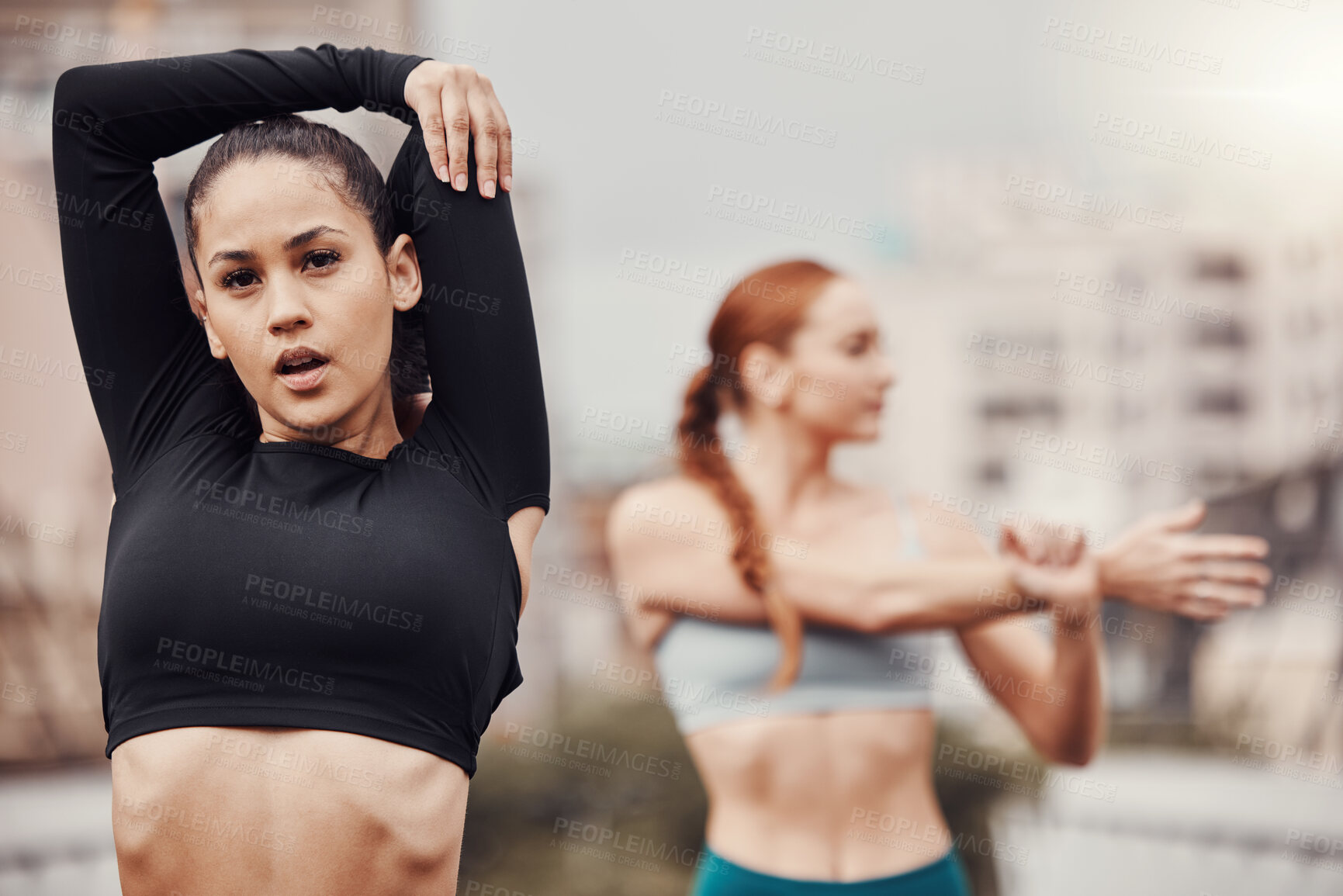 Buy stock photo Exercise, friends and women in city stretching arms for outdoor workout on bridge or road for health and wellness. Sports, motivation and fitness mindset, urban training and people stretch together.