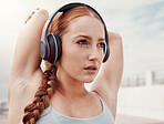 Stretching, fitness and face of woman with headphones listening to music, podcast and audio for warm up. Running, sports and girl start workout, wellness exercise and marathon training in urban city