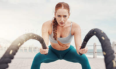 Buy stock photo Woman, battle rope exercise and portrait at ocean park for fitness, strong body and wellness at outdoor training. Girl, focus and workout by sea with goal, target or motivation for muscle development