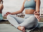 Fitness, hands and woman in yoga meditation for spiritual wellness, mind and body on mat in the city. Hand of calm female yogi in relax lotus pose for healthy wellbeing, zen or exercise in Cape Town