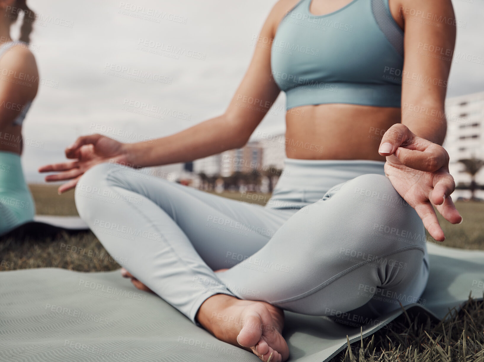 Buy stock photo Fitness, hands and woman in yoga meditation for spiritual wellness, mind and body on mat in the city. Hand of calm female yogi in relax lotus pose for healthy wellbeing, zen or exercise in Cape Town