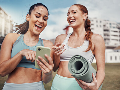 Buy stock photo Yoga, fitness and phone with woman friends laughing at a meme in the park together during exercise. Pilates, social media and training with a female and friend joking outside on a field for a workout