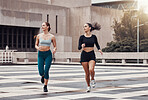 Fitness, city and friends running together for wellness, energy or outdoor exercise. Sports, healthy women and runner athletes training for cardio workout in urban town with freedom, power and action