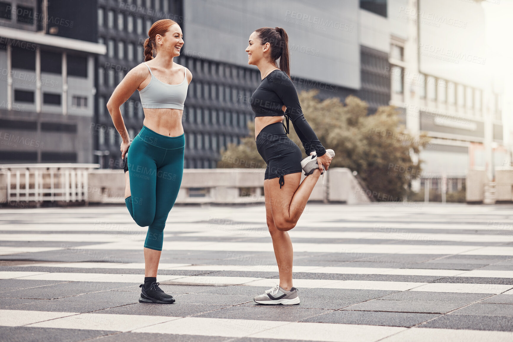 Buy stock photo Fitness, woman and friends stretching in the city for running, cardio exercise or workout. Active women in warm up stretch together in preparation for exercising, run or sports workout in urban town