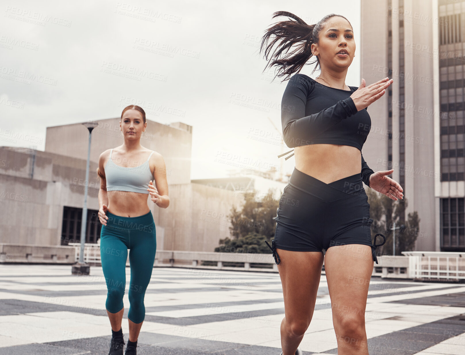 Buy stock photo Women, running in city and fitness, runner outdoor for cardio and exercise friends race in Cape Town for active lifestyle. Sports, health and body training, run on urban rooftop with healthy people