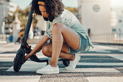 Buy stock photo Black woman, scooter and eco friendly travel in city, adventure and fixing the wheel of ebike outdoor. Sustainable transportation, freedom with carbon footprint and transport in urban street in Miami