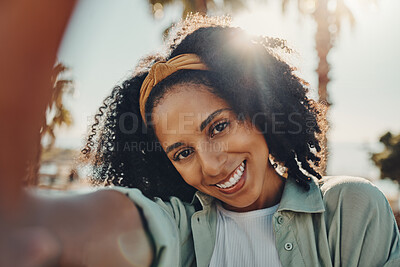 Portrait, selfie smile and happy black woman taking pictures to remember memory, social media or profile picture. Face, beauty and female from South Africa talking photo outdoors in nature or park.