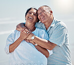 Retirement couple, laughing and hug at beach for love, care and relax on summer holiday, trust or date. Happy senior man, woman and embrace at sea for happiness, support and smile in outdoor sunshine