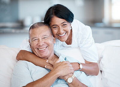 Buy stock photo Love, retirement and portrait with a senior couple in the living room of their home together to relax. Sofa, bonding or marriage with a mature man and woman relaxing in the lounge of their house