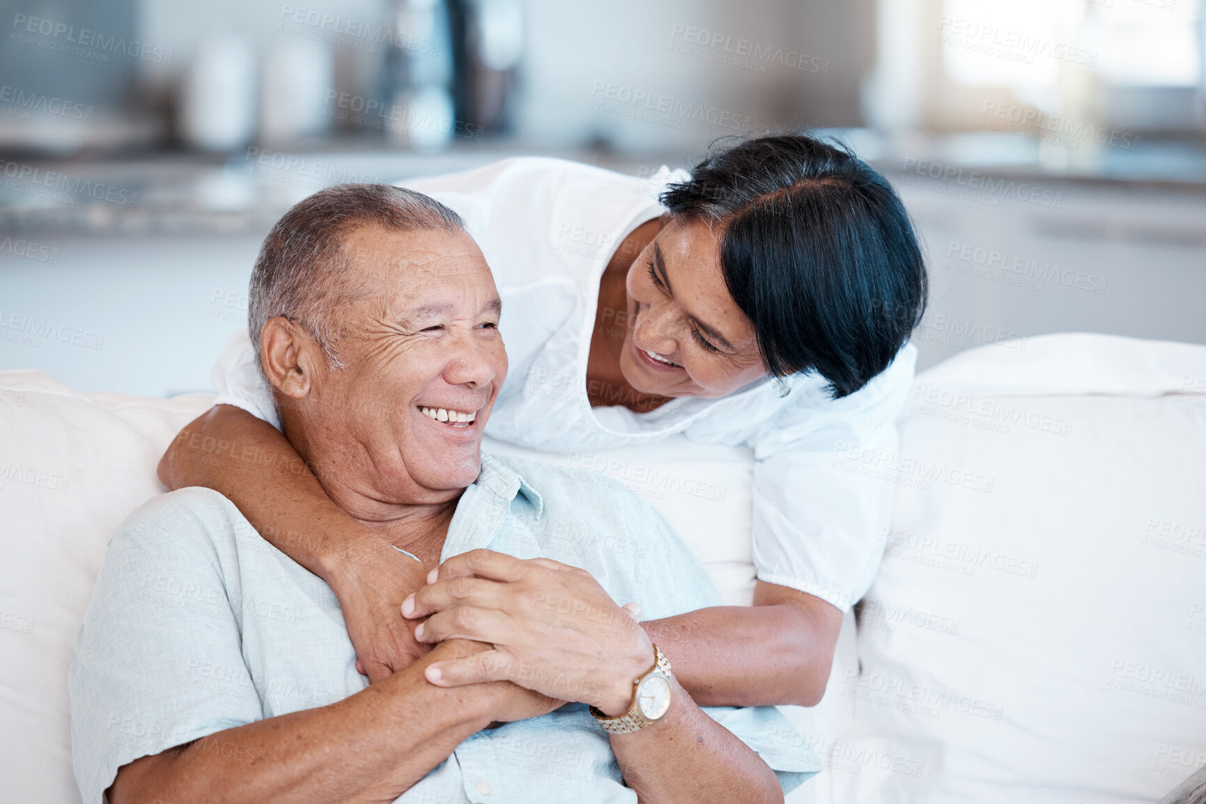 Buy stock photo Love, retirement and smile with a senior couple in the living room of their home together to relax. Sofa, bonding or marriage with a mature man and woman relaxing in the lounge of their house