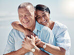Senior couple, beach and hug of love, relax and trust on summer holiday, vacation or date. Happy retirement, man and woman embrace at ocean for happiness, support and smile outdoor in calm sunshine