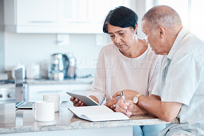 Buy stock photo Senior couple debt, tablet and home of elderly people in retirement looking at budget data. Pension, house research and finance loan of a Indian woman and man together in a kitchen planning with tech