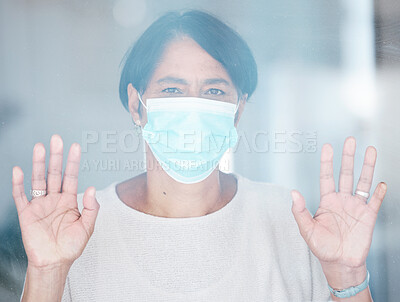 Buy stock photo Old woman, face mask and Covid with health and safety, sad portrait with hands on window and isolation. Retirement, lockdown and compliance with law, healthcare rules and hygiene to stay healthy