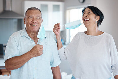 Buy stock photo Covid, mask remove and senior couple portrait with a smile at home in a kitchen. Happy man, mature and marriage of a grandparents in a house laughing with love and care in a household to relax