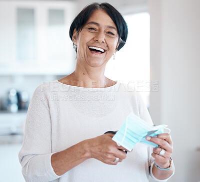Buy stock photo Senior woman, portrait and covid face mask with a scissor in hands for cutting while happy about freedom. Face of old person in house with smile for change, vaccine and corona recovery in retirement 