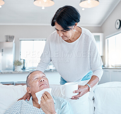 Buy stock photo Health, old man with flu and senior woman with cup, retirement and caregiver in living room. Allergies, mature male on couch and elderly female in lounge with mug, bacteria and remedy for illness