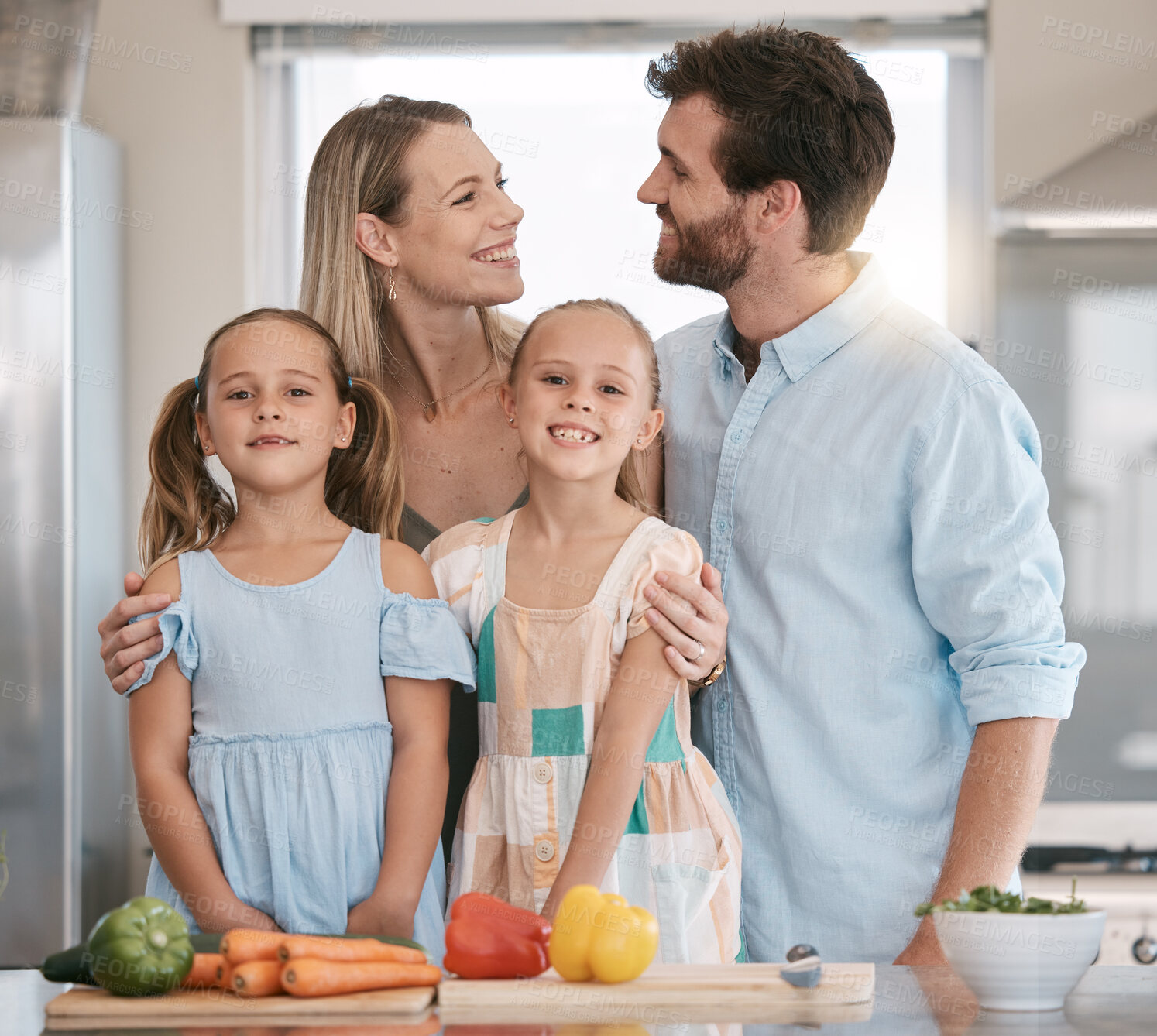 Buy stock photo Parents, food and portrait of children cooking with vegetables for lunch, dinner or ingredients for meal prep. Family, smile and mom, dad and girls learning, teaching and helping at kitchen table