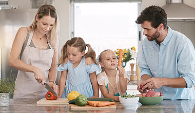 Buy stock photo Parents, food and children cooking in kitchen with vegetables for nutrition, vegan lifestyle and healthy eating. Food, family and mom, dad and girls learning and help for meal prep, dinner or lunch