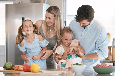 Buy stock photo Fun, playful and family cooking food, bonding and children helping in the kitchen for lunch. Happy, laughing and parents playing with girl kids while preparing dinner together for quality time