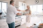 Senior couple, bonding and dancing in kitchen, house or family home in support trust, love or fun energy celebration. Smile, happy and retirement man in dance with elderly woman in romance marriage