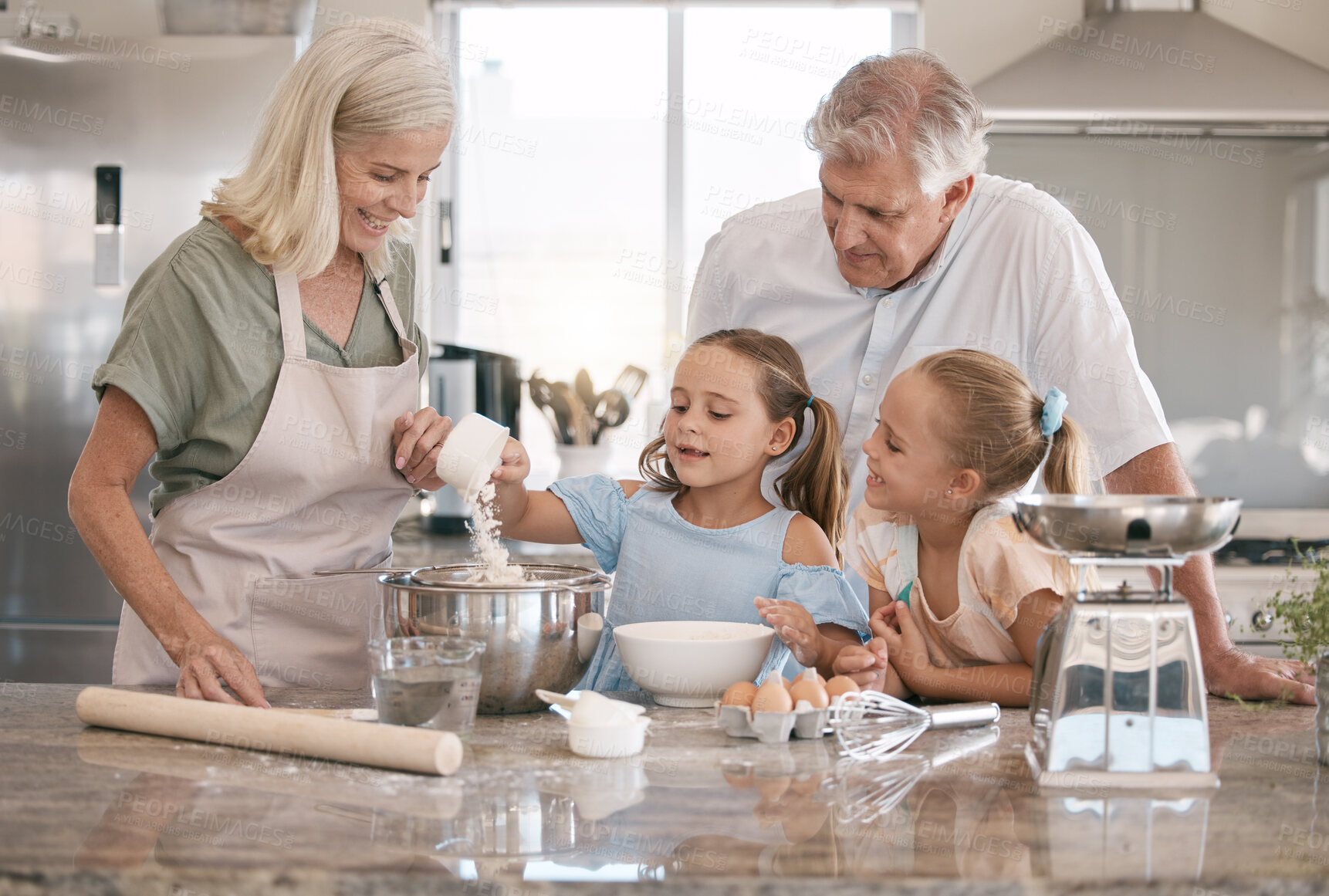 Buy stock photo Kitchen, baking and senior family with children bonding, love and learning in morning with breakfast support. Real people or grandparents and girl kids teaching, cooking and food for home development