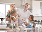 Funny family, baking and children helping grandparents in home kitchen with food. Woman, man and girl kids learning to make cookies, pancakes or cake for breakfast with love, care and fun teamwork