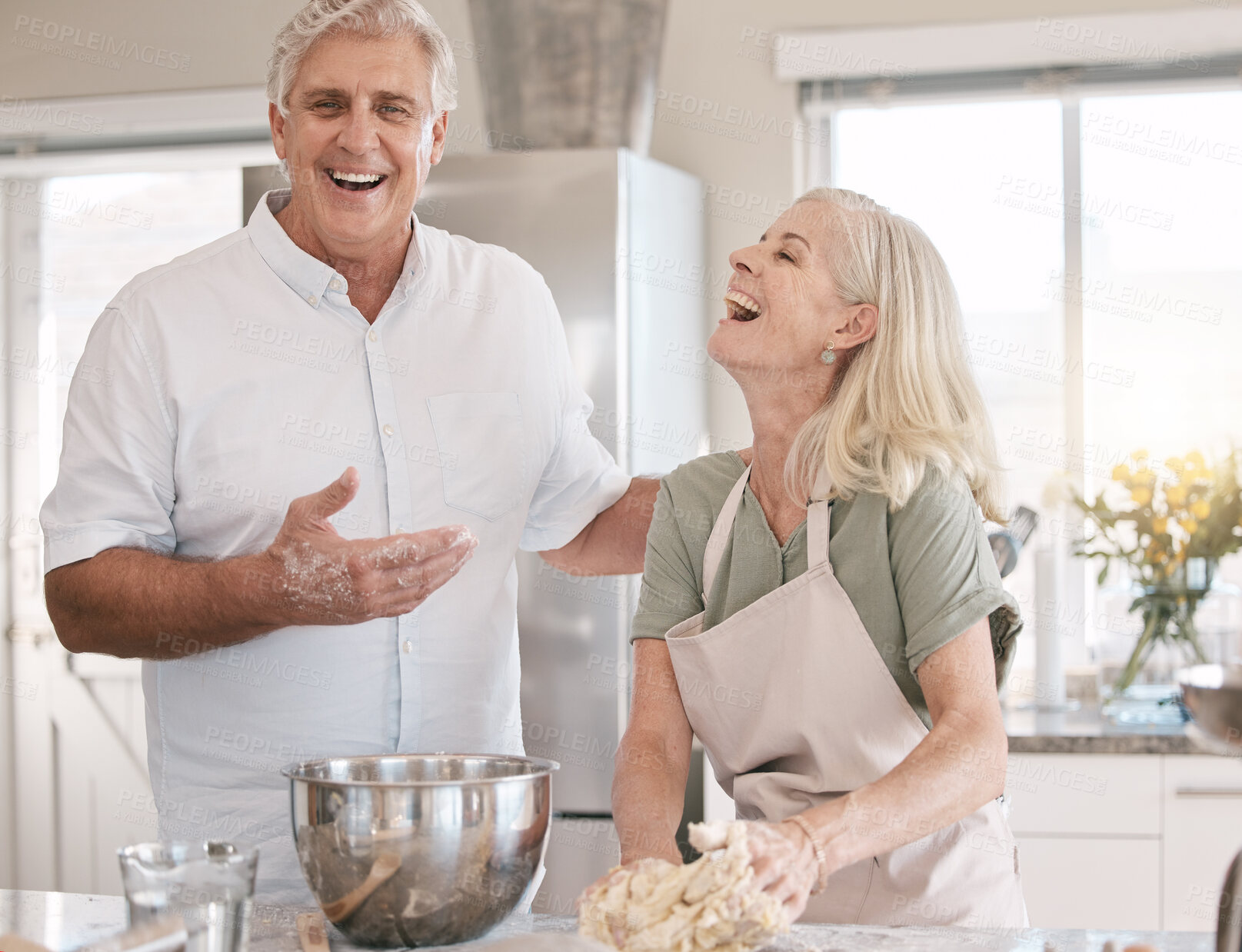 Buy stock photo Old couple baking together, happy with baker skill and spending quality time in retirement, marriage and laughter. Funny with elderly people in kitchen, trust and bonding with cooking and happiness 