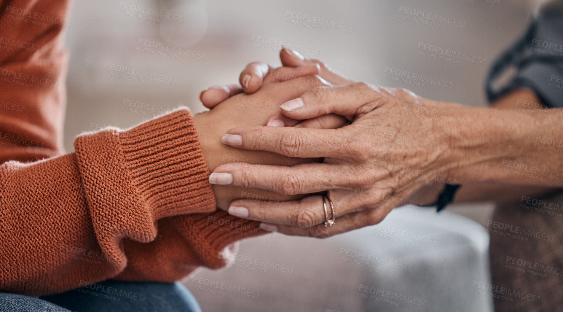 Buy stock photo Women, holding hands and closeup for therapy, mental health support or consultation for problem on sofa. Woman, helping hand and psychologist for wellness conversation, advice or care for depression