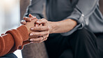 Woman, holding hands and closeup for therapy, support and consultation for mental health problem on sofa. Women, helping hand and psychologist with talk, advice and care for anxiety with depression