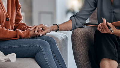 Buy stock photo Woman, holding hands and closeup for therapy consultation, support and mental health problem on sofa. Women, helping hand and psychologist with talk, advice and care for depression in clinic office