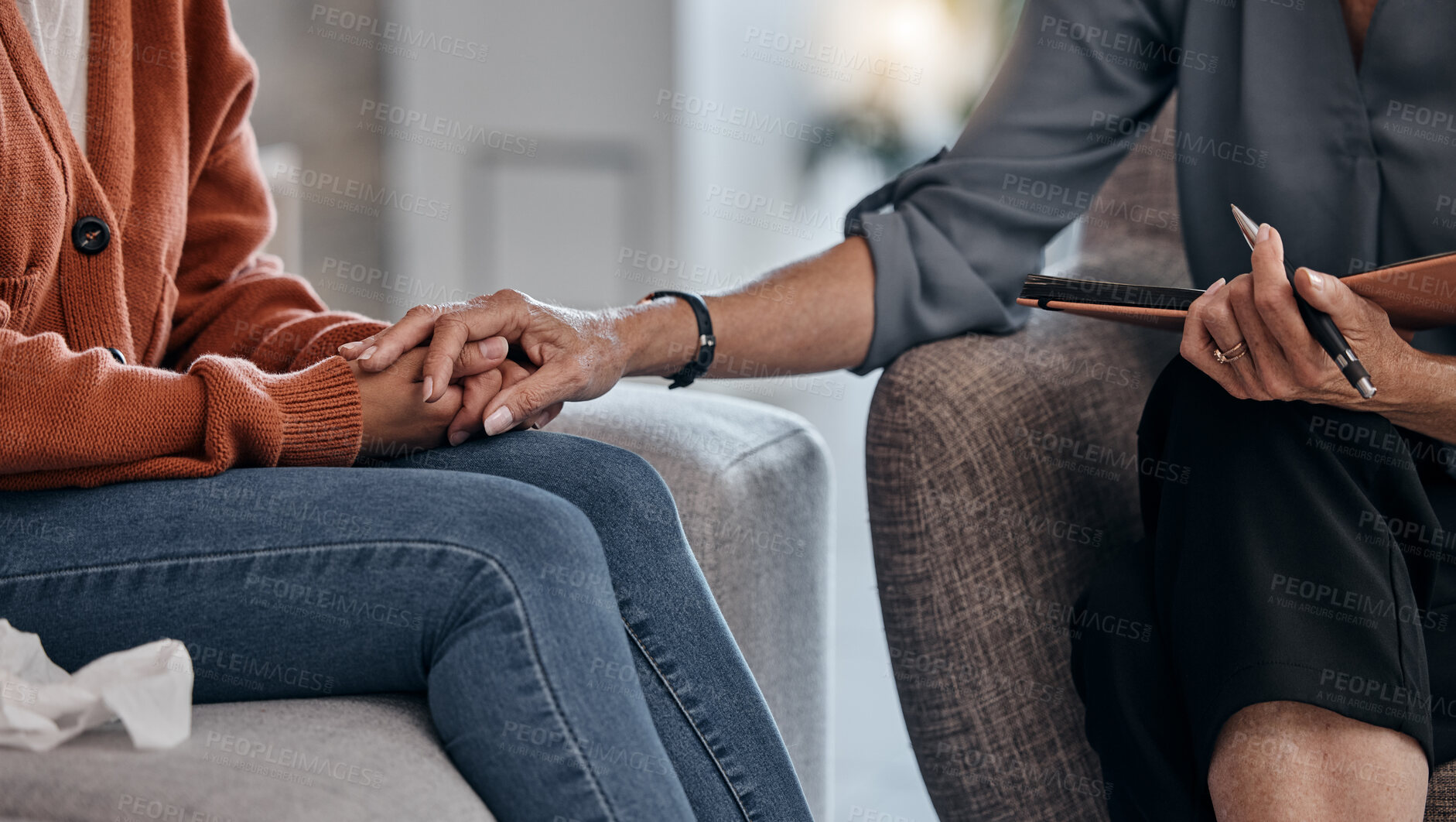 Buy stock photo Woman, holding hands and closeup for therapy consultation, support and mental health problem on sofa. Women, helping hand and psychologist with talk, advice and care for depression in clinic office