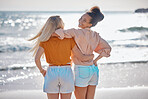 Back view, hug or friends at a beach to relax talking or laughing on summer holiday vacation in Florida, USA. Bonding, happy or young women enjoy traveling to sea or ocean on girls trips with freedom