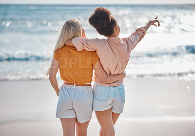 Buy stock photo Woman, friends and hug in relax at the beach for summer vacation, travel or journey together in the outdoors. Interracial women hugging and enjoying trip, traveling or adventure by the ocean coast