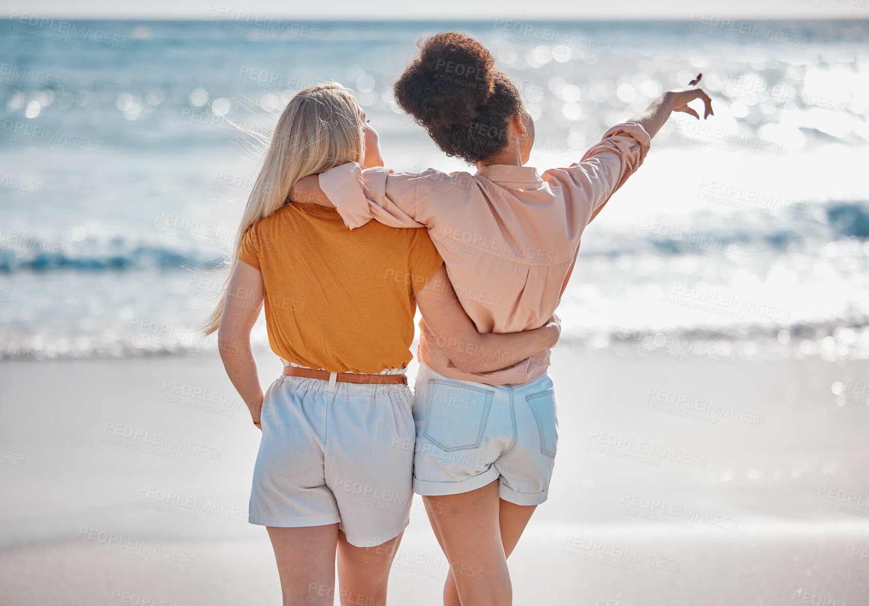 Buy stock photo Woman, friends and hug in relax at the beach for summer vacation, travel or journey together in the outdoors. Interracial women hugging and enjoying trip, traveling or adventure by the ocean coast