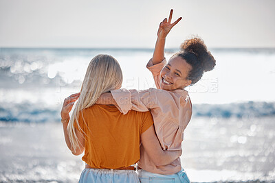 Buy stock photo Hug, peace sign and portrait of friends at the beach for summer, holiday and bonding in Miami. Travel, freedom and back of women with hand emoji for carefree energy, playful and happy by the sea