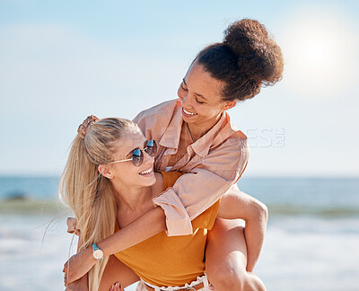 Buy stock photo Piggyback, beach and happy couple of friends with lgbtq, lesbian or love freedom on summer vacation. Blue sky, ocean and diversity women on date, fun support and valentines holiday with hug by sea