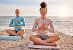 Yoga, meditation and friends outdoor on a beach together for mental health or wellness in summer. Exercise, diversity or nature with a female yogi and friend practicing meditation for fitness outside