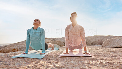 Buy stock photo Pilates, stretching and woman friends on the beach together for mental health, wellness or balance in summer. Exercise, diversity or nature with a yoga female and friend outside for inner peace