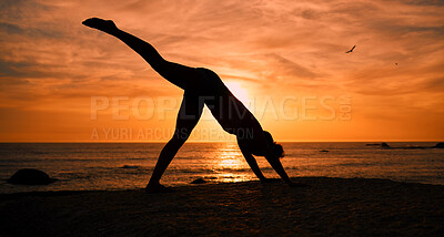 Buy stock photo Fitness, yoga and silhouette of woman at sunrise on beach for exercise, training and pilates workout. Morning, meditation and shadow of girl balance by ocean for sports, wellness and stretching legs